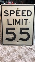 SPEED LIMIT SIGN WITH A COUPLE OF BULLET HOLES