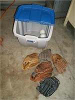 Bin with Softball gloves and balls