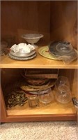 Corner Kitchen Cabinet full of glassware, plates