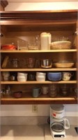 Pyrex containers & dishes in kitchen cabinet