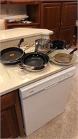 Assortment of frying pans and mixing bowls