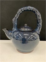 navy blue Pottery teapot (crack in lid)