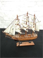 3 Mast replica wooden ship model on a stand.