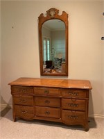 A French Country-style Dresser and a Wall Mirror