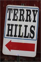 WOODEN TERRY HILLS SIGN ON METAL POST