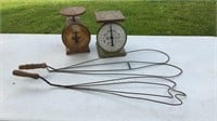 Two vintage scales and two antique rug beaters