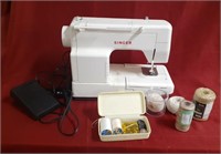 Singer sewing machine, thread, pins, twine