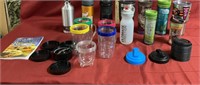 Magic bullet attachments, Starbucks cups, water