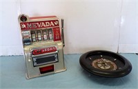 SMALL METAL SLOT MACHINE, 10" HIGH, WORKS AND....