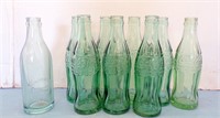 (8) COCA COLA BOTTLES MARKED LEAD S. DAK. AND....