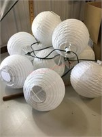 2 sets of lighted white paper lanterns