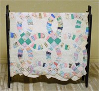 Quilt Stand and Hand-Quilted Quilt.