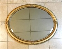 Gilt Framed Oval Beveled Mirror.