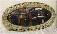 Beveled Oval Gilt Wood Mirror.