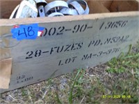 old fuse crate with misc metal brackets