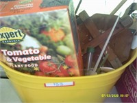 yellow bucket with plant food, garden supplies,