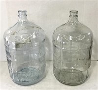 2 18 ltr glass jugs.