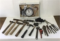 Assorted tools and tool wall clock.
