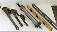 Assorted pipe wrenches. Vintage levels and