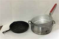 Cast iron pan and shallow pot with fry basket.