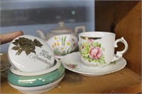 Shelf of china - tea pot, cup, butterfly dishes,