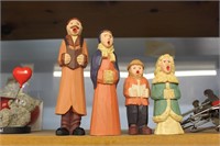 Wood carved Christmas carolers, ceramic santa