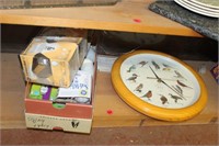 box of lightbulbs and bird clock