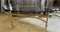 Oval brass and glass coffee table