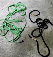 Pair of collapsible hoses.