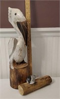 2 carved wooden birds