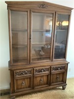 China hutch with glass doors and three shelves.