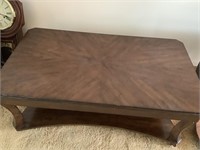 Heavy Coffee table on casters.  47” long x 27”