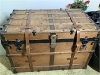 Antique wooden and metal trunk with leather