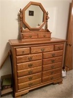 Chest of drawers with additional mirrored top.