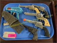 Tray of kids toy guns