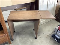 Desk with fold up shelf
