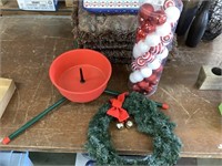 Tree stand, wreaths and full container of