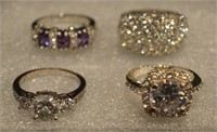 (4) costume jewelry rings all CZ & size 6.75