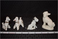 (4) porcelain miniature dog figurines