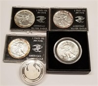 4 Silver Eagles; 1 .999 One Ounce Round