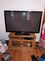 Samsung tv and entertainment center