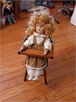 Doll in high chair
