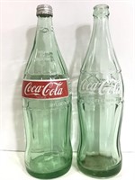 Two vintage glass Coca-Cola bottles