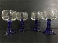 Set of four small glass blu stem goblets