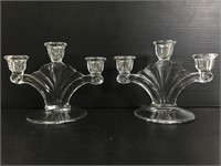 Two glass triple candlestick holders