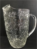 Embossed floral glass pitcher