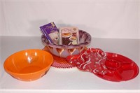 Plastic bowls, serving platters and cookbooks