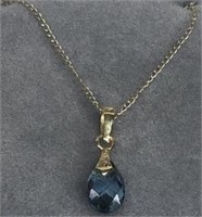 14 karat gold necklace with blue stone