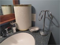wastebasket, soap, toothbrush, towel holders