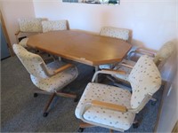 oak kitchen table, 6 arm chairs w/wheels